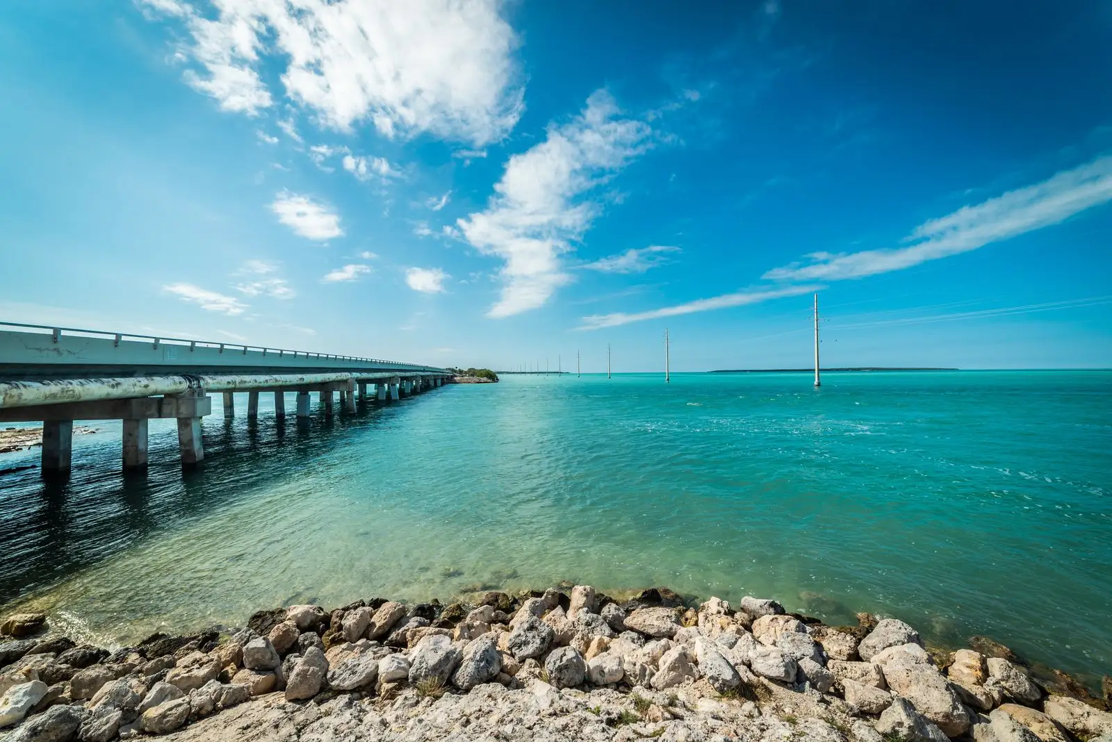 A long bridge running out over turquoise water in the Florida Keys