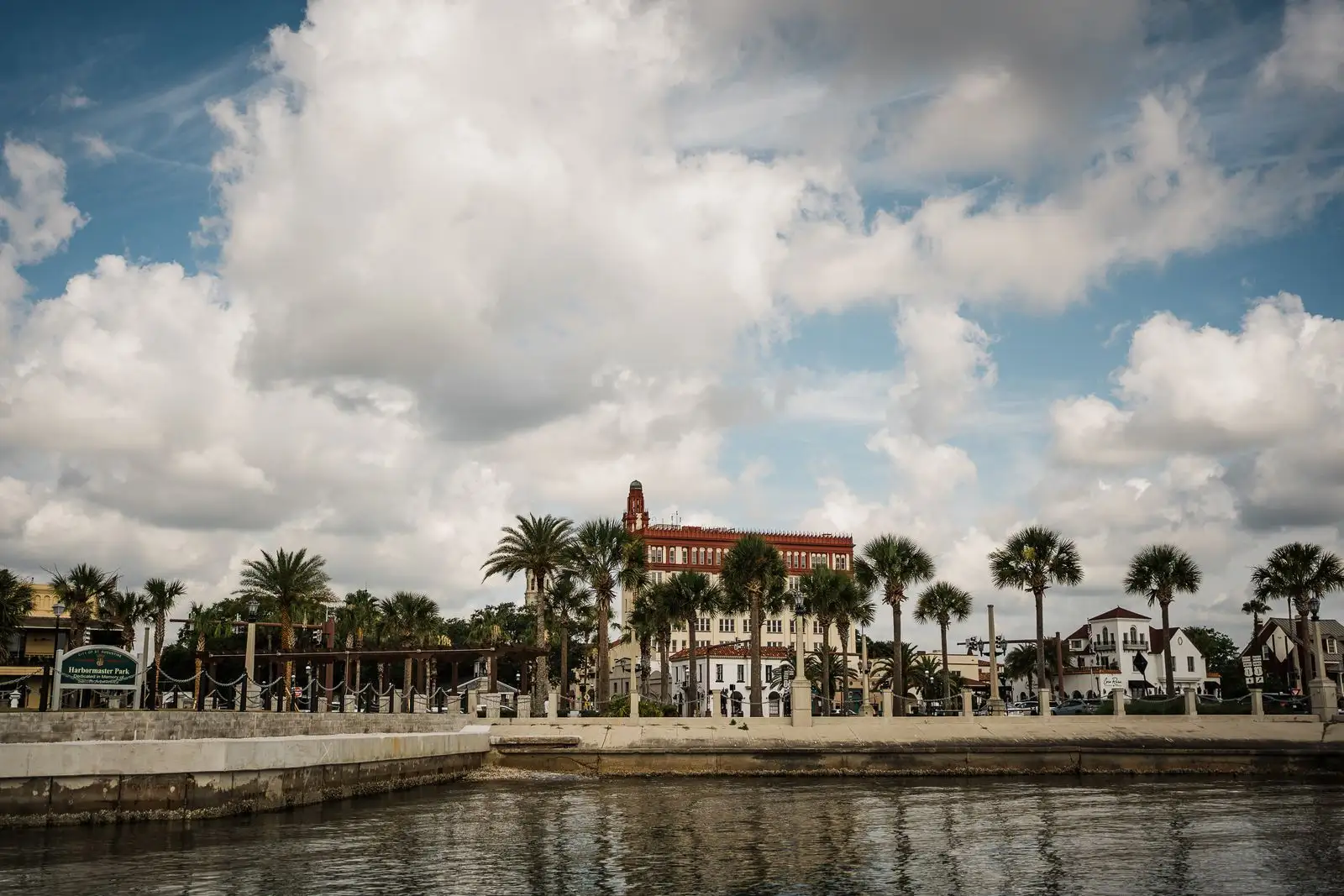St. Augustine's bayfront, with palm trees and historic buildings beyond the seawall