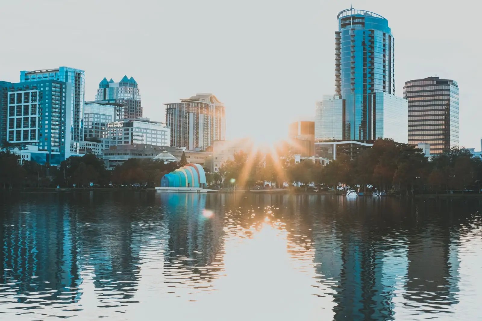 Downtown Orlando's skyline reflected in Lake Eola at sunrise