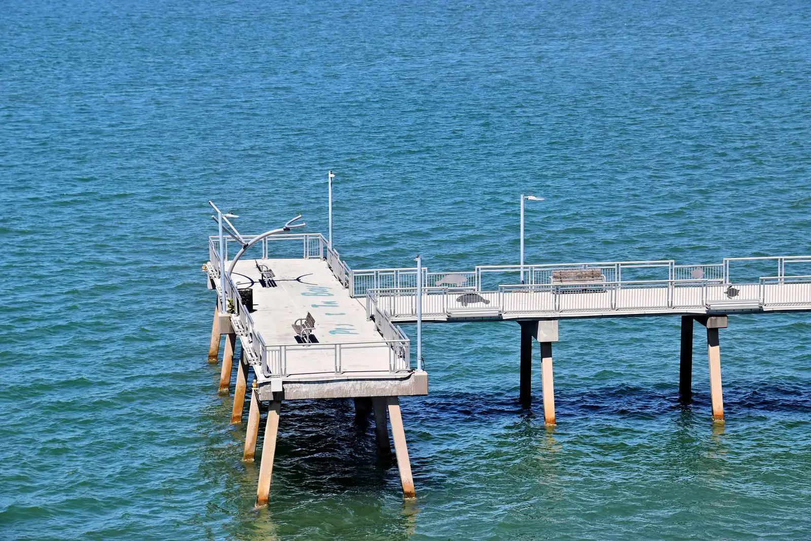 A fishing pier over blue water in Sarasota